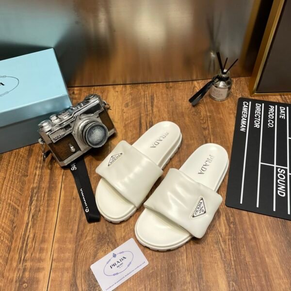 PR Triangle Logo Slides White - Slides