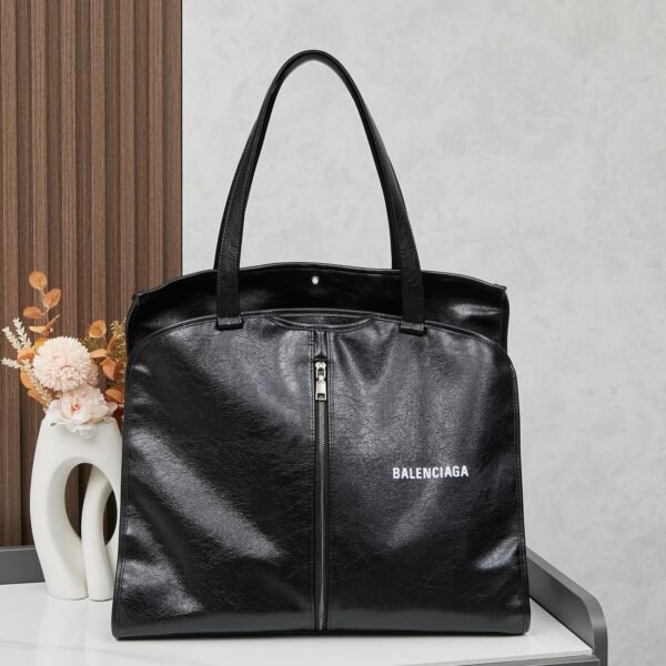 BAL Comes with a box. The trash bag trend is huge, and