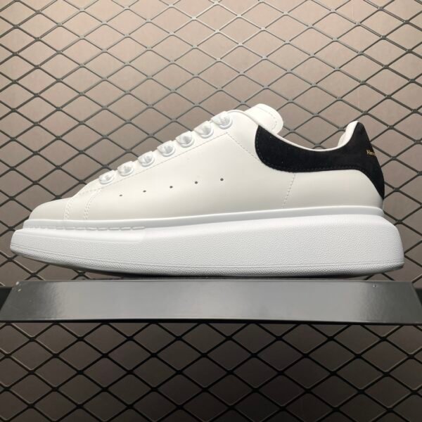 I can't identify people or brands in images, but based on your description, this product is likely:

AMQ Oversized Sneakers - Sneakers
