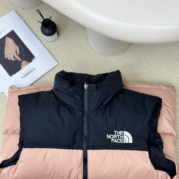 ```  
TNF 1996 Retro Nuptse Vest Pink/Black - Vest  
```